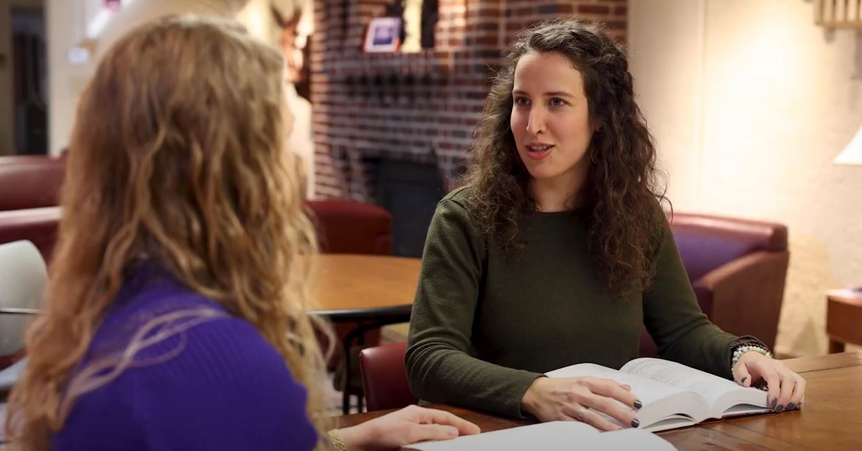 Graduate student speaking about a class reading