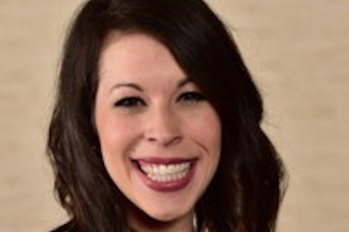 Studio headshot of economics alumna Alyssa Toay.