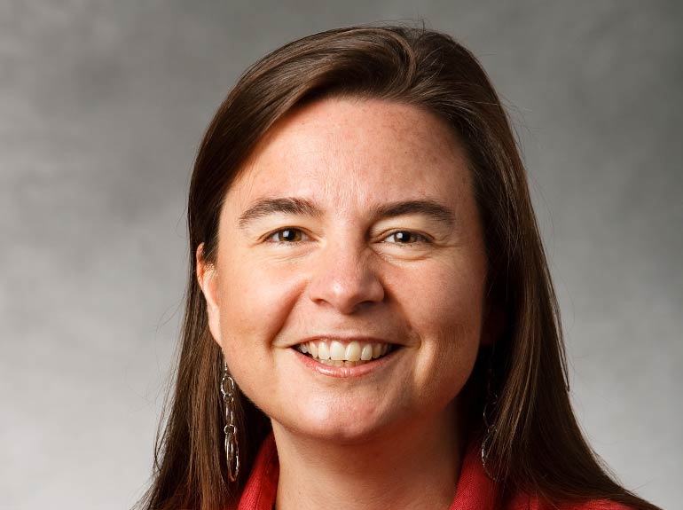 Studio headshot of Dr. Elizabeth Wilkinson. 